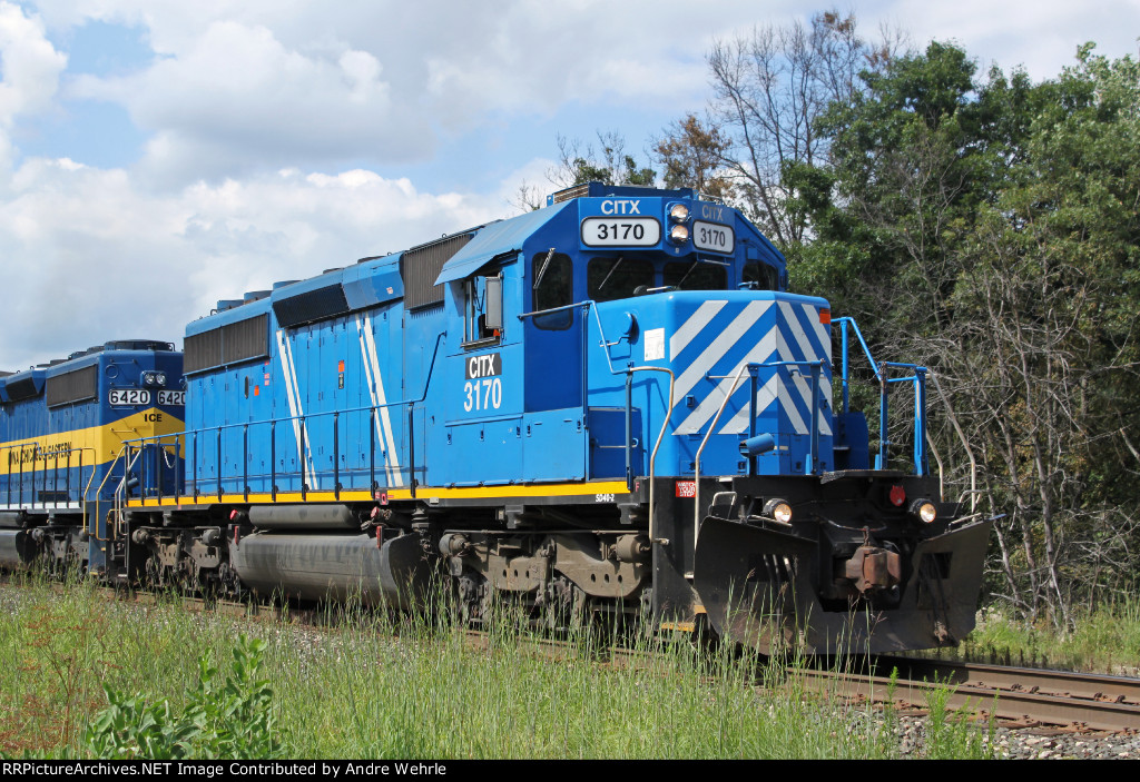 CITX 3170 throttles up after holding at Kilbourn to let the Empire Builder overtake